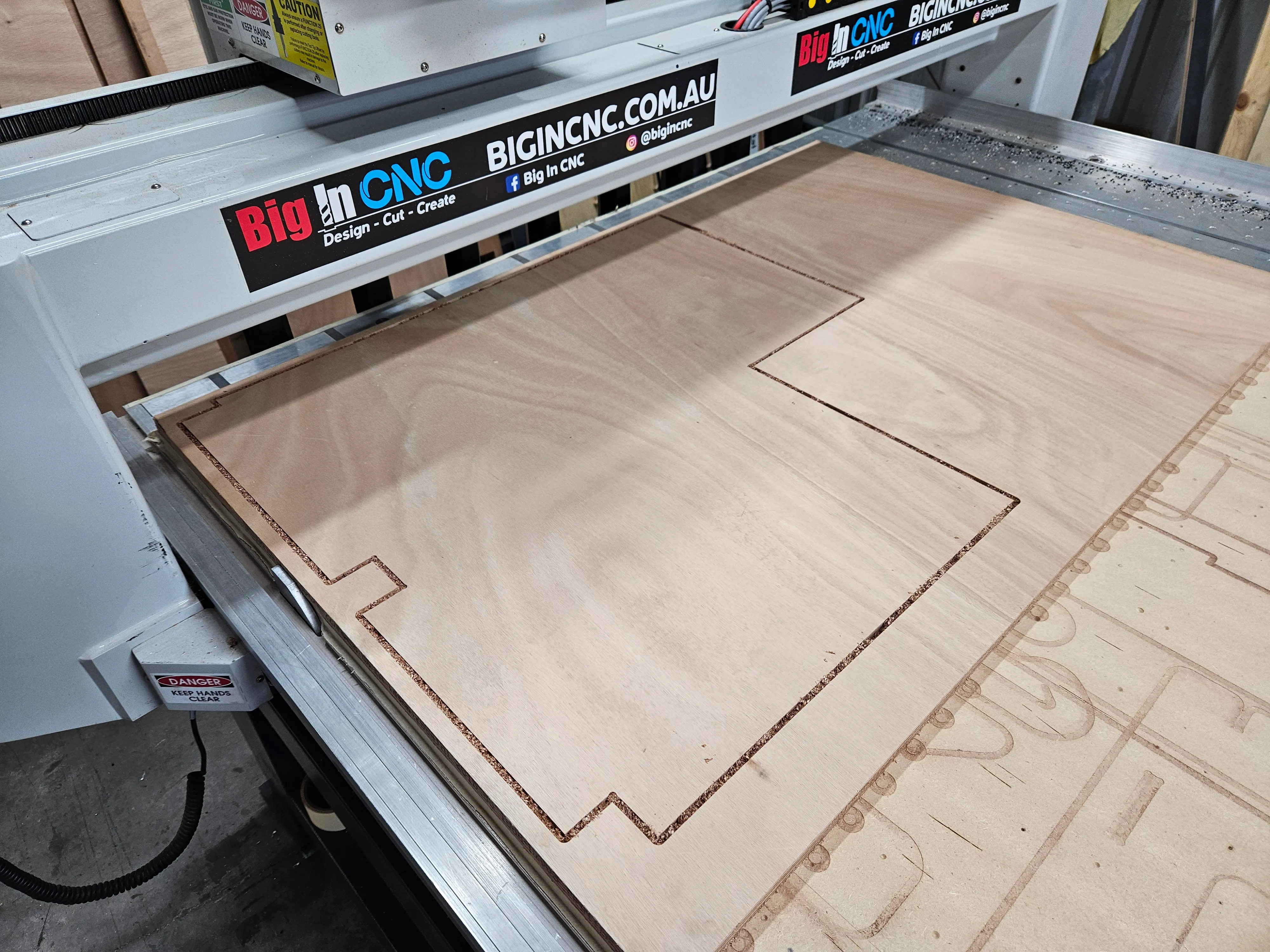 An 18mm marine ply boat floor panel being cut on the Multicam